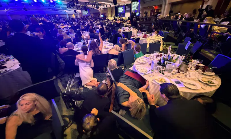 Guests take cover after US President Donald Trump and first lady Melania Trump were rushed out of the White House Correspondents' Association dinner by Secret Service agents after a loud, unidentified noise, in Washington, DC. -- Reuters