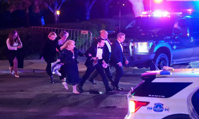 Attendees leave the venue as a shooter opens fire during the annual White House Correspondents' Association dinner in Washington, DC. -- Reuters