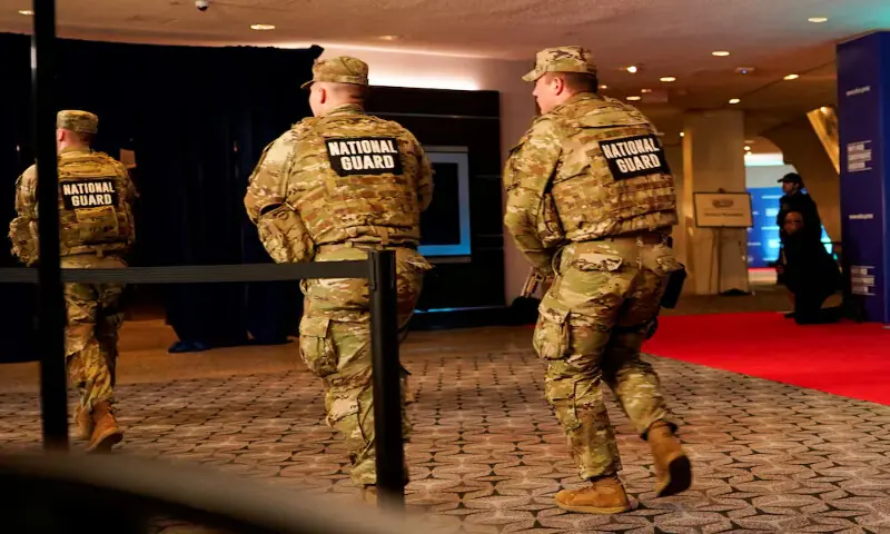 Members of the National Guard run next to the red carpet as a shooter opens fire during the annual White House Correspondents' Association dinner in Washington, DC. -- Reuters
