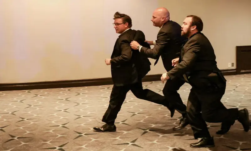 US House Speaker Mike Johnson is evacuated as a shooter opens fire during the annual White House Correspondents' Association dinner in Washington. -- Reuters