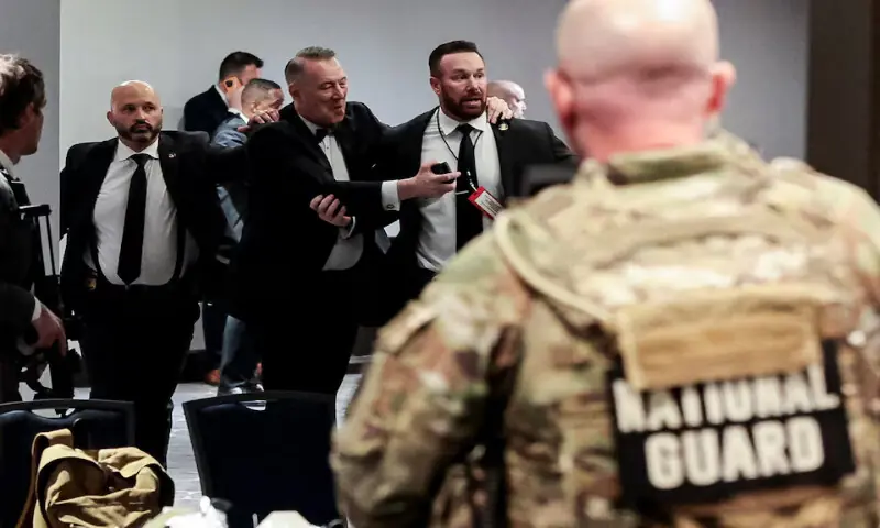 Security officials evacuate guests as a shooter opens fire during the annual White House Correspondents' Association dinner in Washington, DC. -- Reuters