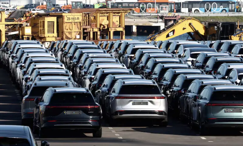 New China-built electric vehicles are seen parked in the port of Zeebrugge, Belgium. -- Reuters