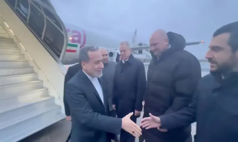 Iran's Foreign Minister Abbas Araqchi is greeted by Russian officials upon his arrival in St. Petersburg on Monday. -- Reuters