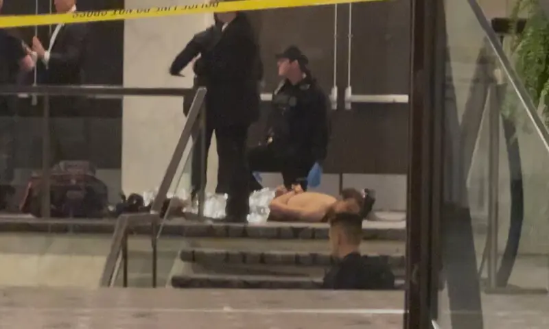 Cole Tomas Allen lies on the floor after being detained by law enforcement personnel in Washington, DC. -- Reuters