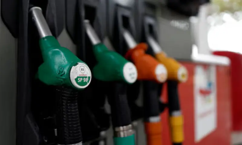 Fuel pump nozzles for gasoline at a TotalEnergies gas station in Paris, France. -- Reuters