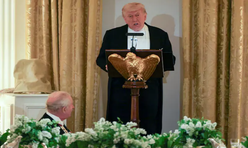 Britain's King Charles listens as US President Donald Trump speaks during a state dinner for the King and Queen Camilla at the White House in Washington. -- Reuters