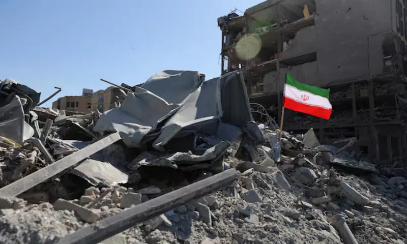 The national flag of Iran flies in the wind as debris lies scattered in the aftermath of an Israeli and US strike on a police station in Tehran, Iran. -- Reuters