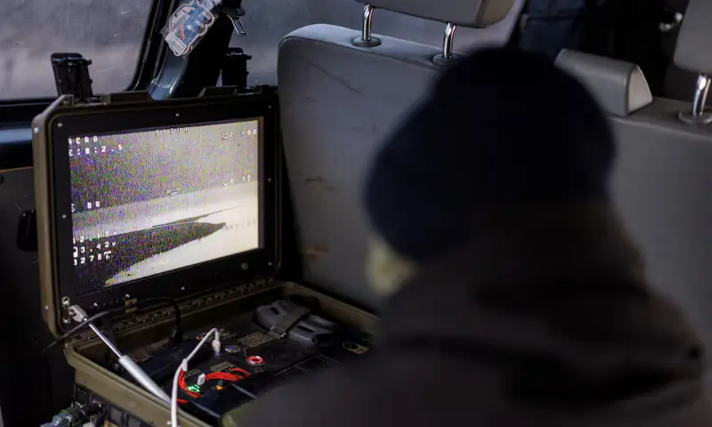 Service members of an air defence unit fly with a P1-Sun FPV interceptor drone during their combat shift in Kharkiv region. -- Reuters