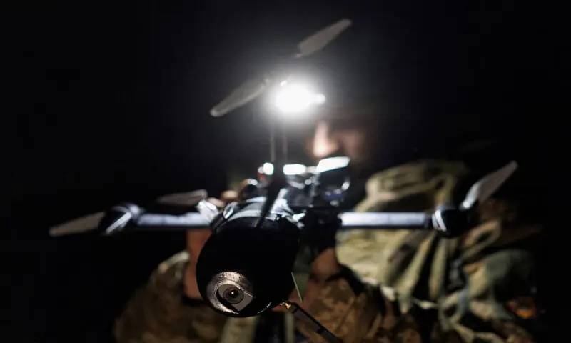 Yuriy, a service member of an air defence unit, prepares to fly a P1-Sun FPV interceptor drone during his combat shift in Kharkiv region. -- Reuters