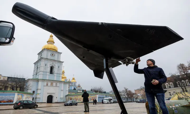 A resident touches a Russian-Iranian Shahed-136 (Geran-2) kamikaze drone installed in front of Saint Michael's Cathedral in Kyiv, Ukraine. -- Reuters file