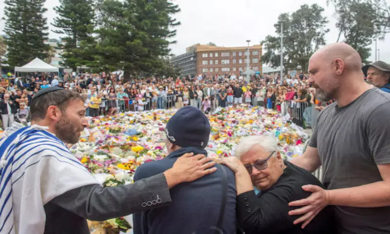 Grandparents of 10-year-old Matilda, who was killed during a mass shooting targeting a Hanukkah celebration on Sunday, grieve at the floral memorial to honour the victims of the mass shooting at Bondi Beach, in Sydney, Australia. -- Reuters