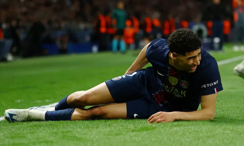 Paris St Germain's Achraf Hakimi reacts after sustaining an injury. -- Reuters