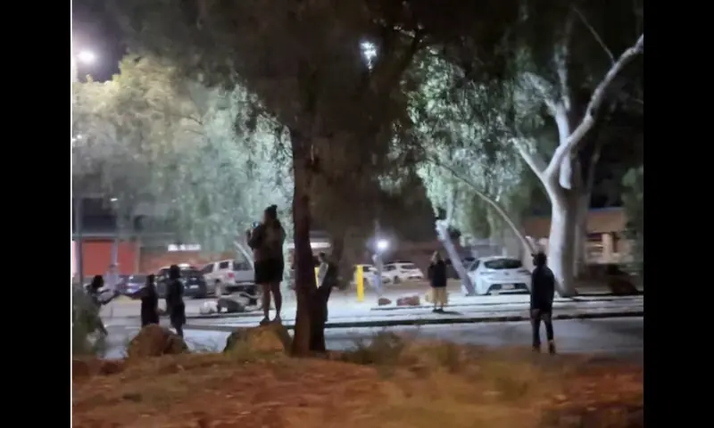 Protesters gather in the streets of Alice Springs, Australia, April 30, 2026, following the arrest of 47-year-old Jefferson Lewis in connection with the murder of a missing five-year-old Indigenous girl, according to the Australian police, in this screengrab from video obtained from social media. Li Chuan. -- Reuters