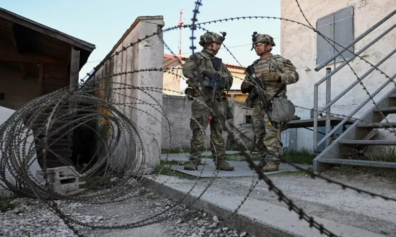 Soldiers stand next to a razor wire at a media day during the US Army Combined Resolve exercise at the US Army's southern Germany training facilities in Hohenfels, Germany. -- Reuters