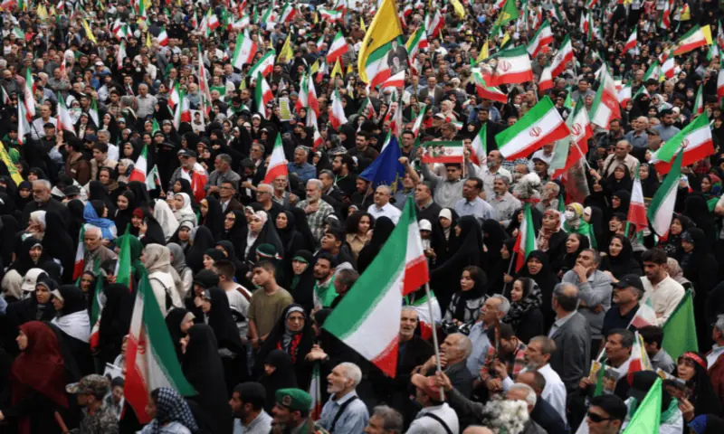 People attend a rally in Tehran, Iran. -- Reuters
