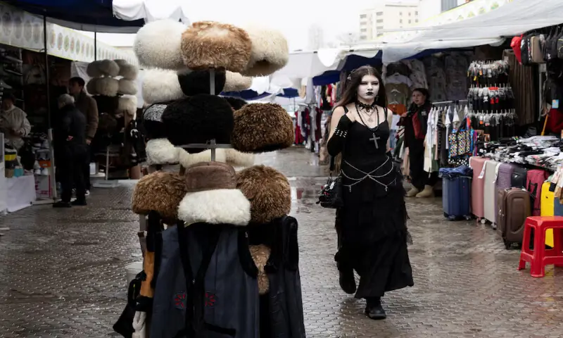 People walk through an open bazaar in Ashgabat, Turkmenistan. -- Reuters