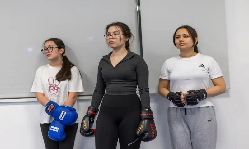 Women listen to their trainer as they practice kickboxing during a session in Ashgabat, Turkmenistan. -- Reuters