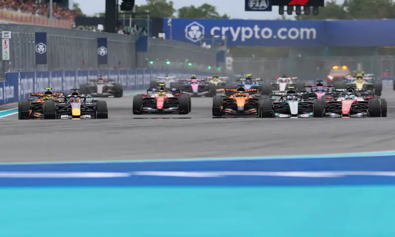 Red Bull Racing driver Max Verstappen, McLaren driver Lando Norris, Ferrari driver Charles Leclerc and Mercedes driver George Russell lead the field into turn one to start the Crypto.com Miami Grand Prix at Miami International Autodrome. -- Reuters