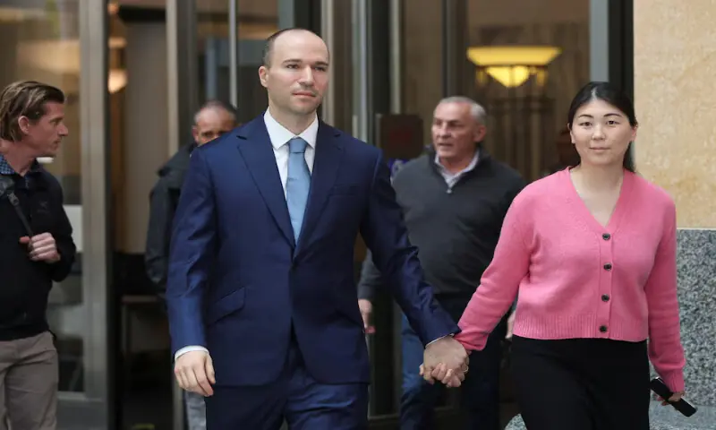 Greg Brockman, president of OpenAI, accompanied by his wife Anna, walks outside a federal courthouse in Oakland, California, US. -- Reuters