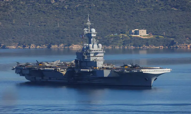 French aircraft carrier Charles De Gaulle departs from Souda Bay, on the island of Crete, Greece. -- Reuters