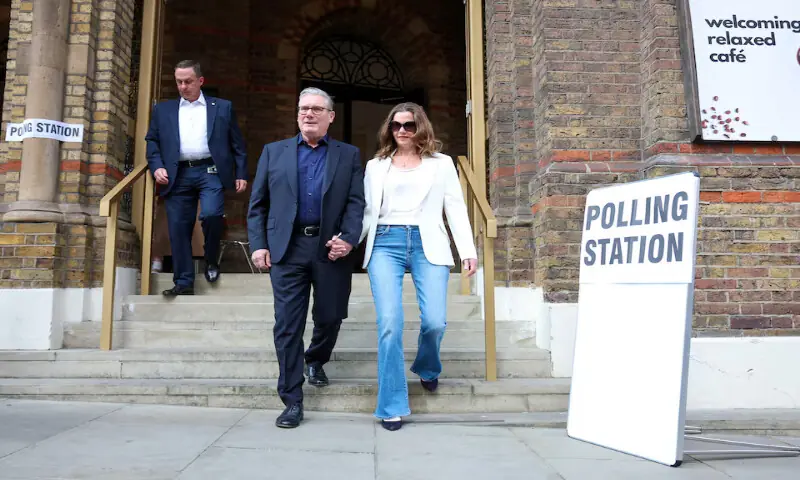 Britain's Prime Minister Keir Starmer and his wife Victoria Starmer leave a polling station in London, Britain, on Thursday. -- Reuters