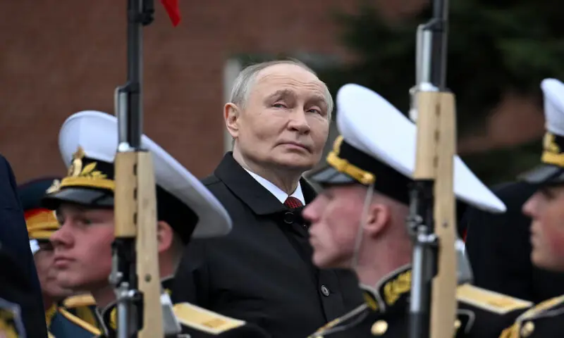 Russian President Vladimir Putin attends a ceremony to lay flowers at the Tomb of the Unknown Soldier by the Kremlin wall in central Moscow, Russia, on Saturday. -- Reuters