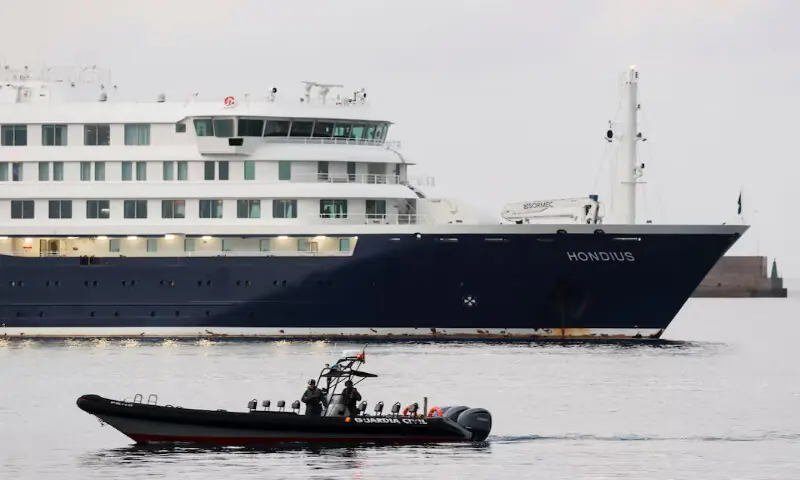 A police boat operates next to the cruise ship MV Hondius at the port of Granadilla de Abona, in Tenerife, Spain, on Sunday. -- Reuters