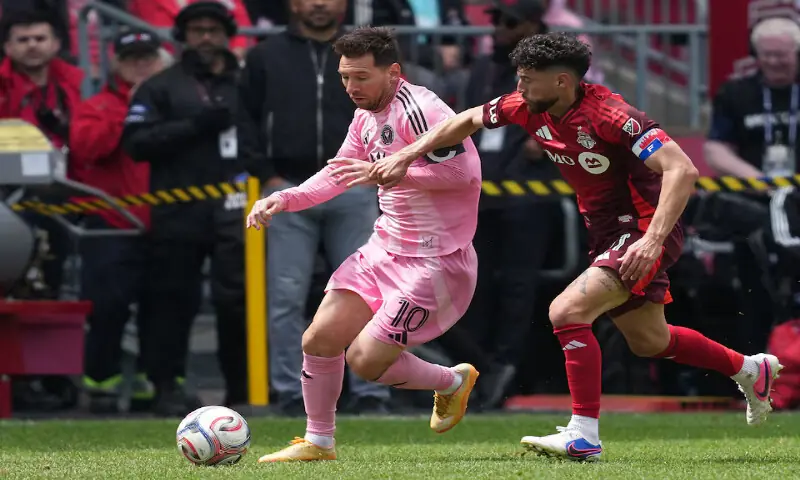 Inter Miami midfielder Lionel Messi battles for the ball with Toronto FC midfielder Jonathan Osorio during the match at BMO Field. -- Reuters