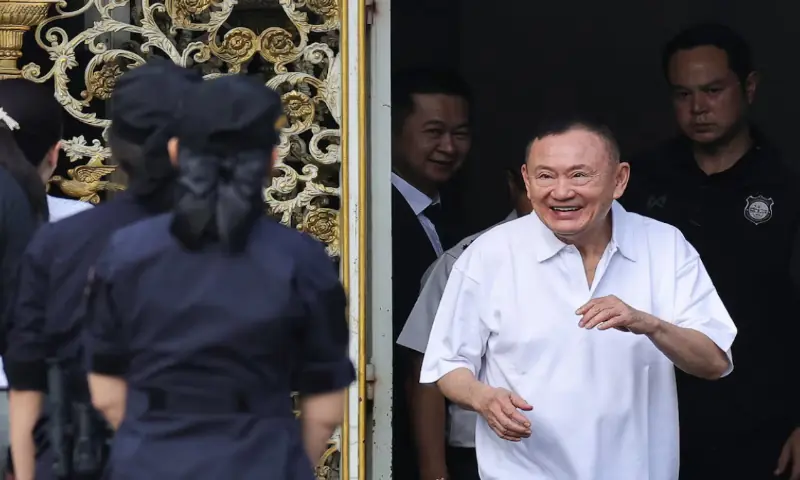 Former Thai Prime Minister Thaksin Shinawatra reacts after being released on parole after serving eight months of his one-year sentence at Klong Prem Central Prison in Bangkok, Thailand. -- Reuters