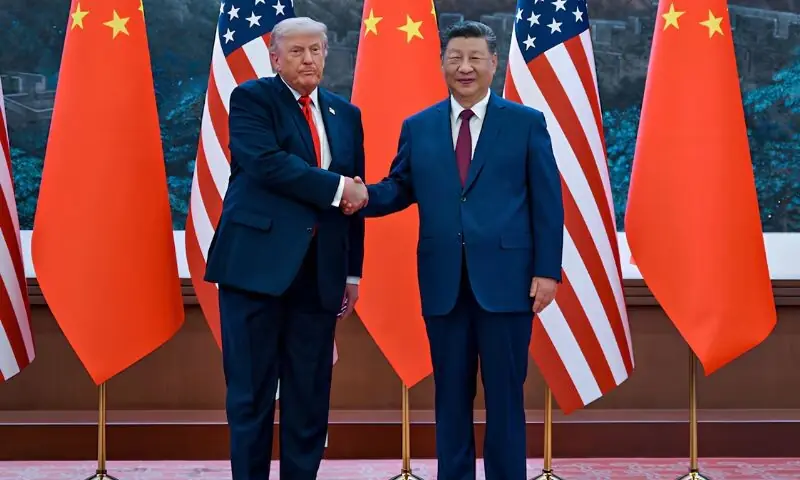 US President Donald Trump shakes hands with China's President Xi Jinping at the Great Hall of the People in Beijing on Thursday. -- Reuters