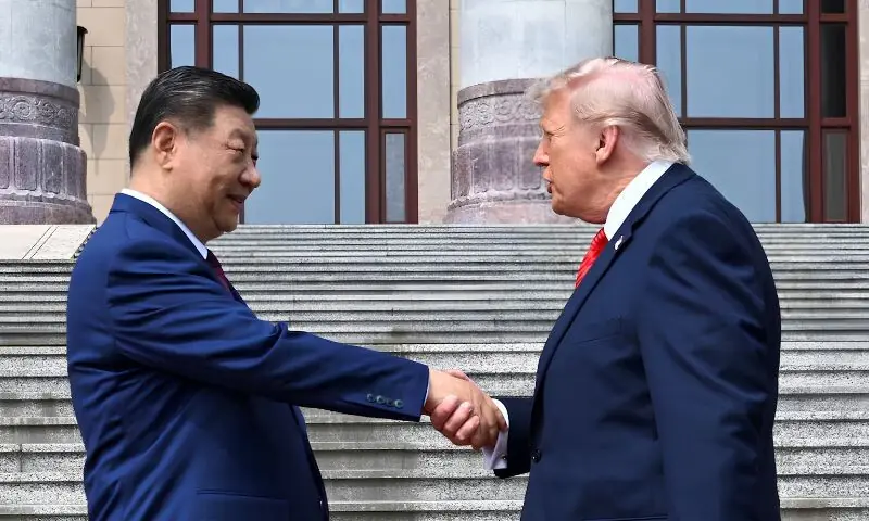US President Donald Trump greets China&rsquo;s President Xi Jinping at the Great Hall of the People in Beijing on Thursday. &ndash; Reuters
