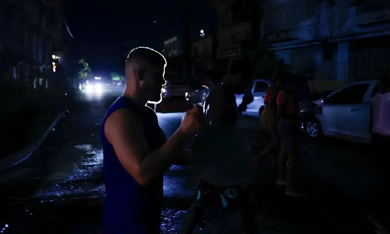 People bang utensils during a protest against frequent power cuts in Havana, Cuba. -- Reuters People bang utensils during a protest against frequent power cuts in Havana, Cuba. -- Reuters