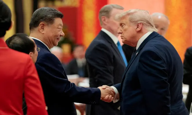 Chinese President Xi Jinping and US President Donald Trump shake hands at a state banquet at the Great Hall of the People in Beijing, China. -- Reuters