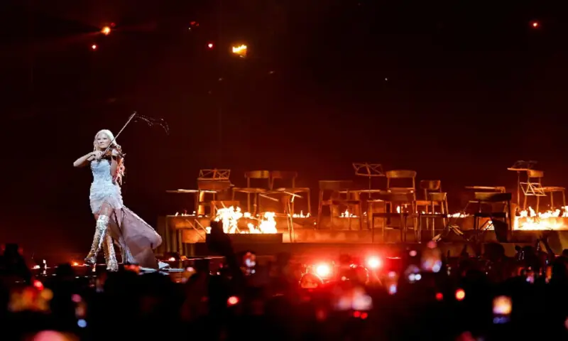 Linda Lampenius plays the violin while she and Pete Parkkonen perform &ldquo;Liekinheitin,&rdquo; representing Finland during the Grand Final of the 2026 Eurovision Song Contest in Vienna, Austria. -- Reuters
