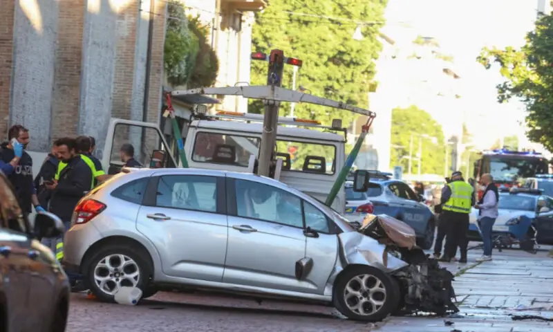 The car that drove into pedestrians is removed from the scene in northern Italian city of Modena. -- Reuters