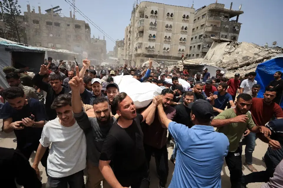 Mourners carry the bodies of Palestinians who were killed in an Israeli strike, according to medics, in Gaza City. -- Reuters
