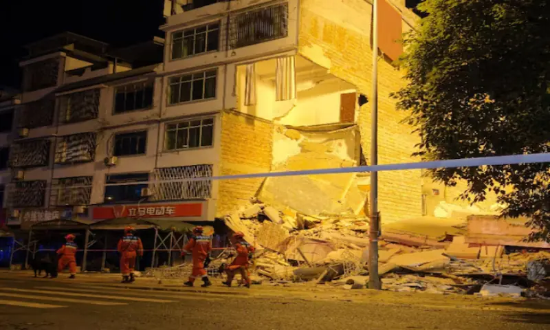 Rescue workers walk past a damaged building following an earthquake at Taiyang village in Liuzhou, Guangxi Zhuang Autonomous Region, China. -- Reuters Rescue workers walk past a damaged building following an earthquake at Taiyang village in Liuzhou, Guangxi Zhuang Autonomous Region, China. -- Reuters