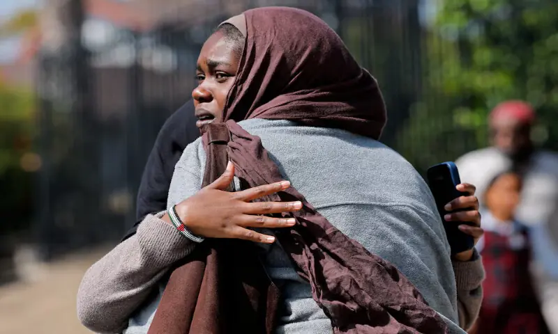 Women wait for the children to walk out of the mosque, at a collecting area, at the scene of a shooting at the Islamic Centre in San Diego, California, US. -- Reuters Women wait for the children to walk out of the mosque, at a collecting area, at the scene of a shooting at the Islamic Centre in San Diego, California, US. -- Reuters