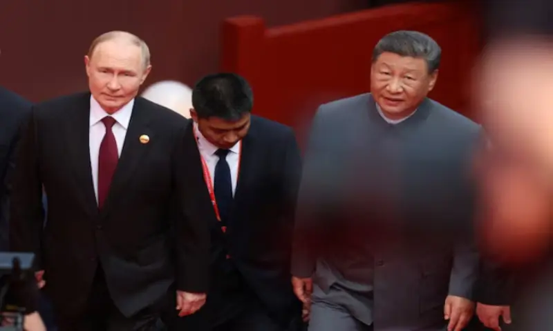 Russian President Vladimir Putin and Chinese President Xi Jinping arrive for a military parade marking the 80th anniversary of the end of World War Two, in Beijing, China. -- Reuters