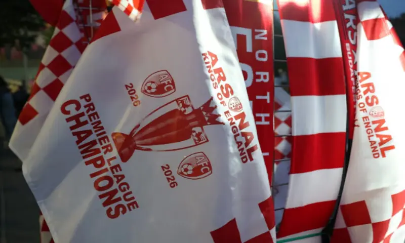 Arsenal Champions merchandise on sale outside the stadium in London. -- Reuters