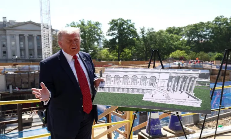 US President Donald Trump shows images of the concept at the site of ongoing construction of the planned White House ballroom in Washington, DC, US. -- Reuters
