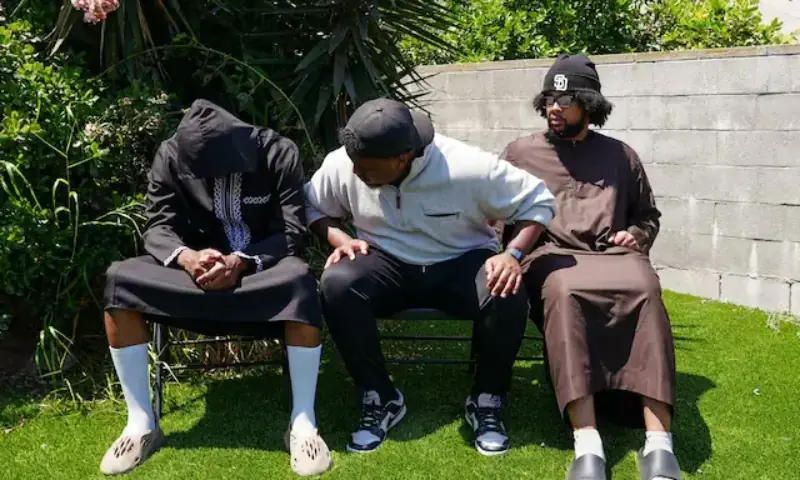 Jibril Abdullah, Mohammed Abdullah and Khalid Abdullah, sons of security guard Amin Abdullah, who was killed in a shooting incident. -- Reuters