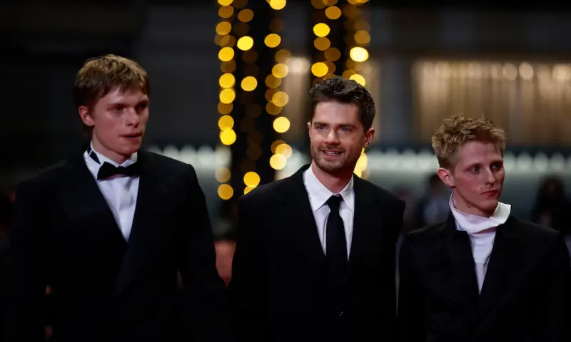 Director Lukas Dhont, cast members Emmanuel Macchia and Valentin Champagne pose on the red carpet during arrivals for the screening of the film "Coward" in competition at the 79th Cannes Film Festival in Cannes, France. -- Reuters
