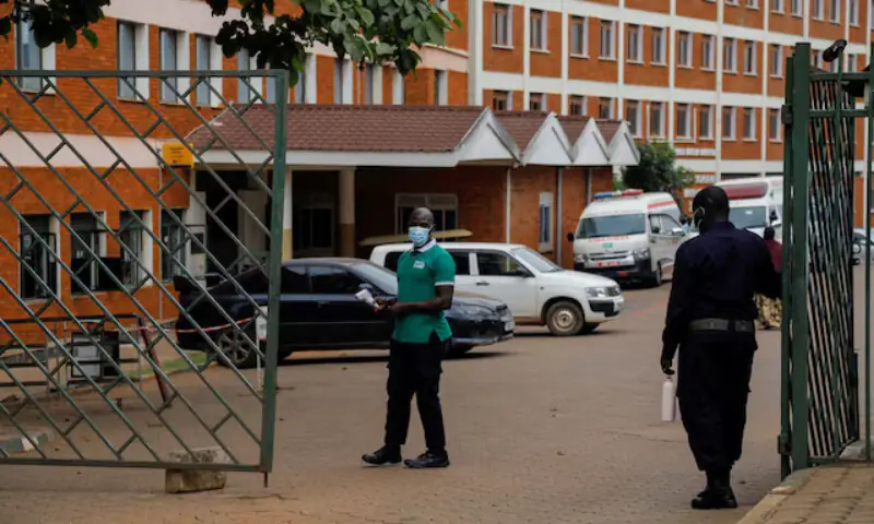 Workers stand guard at the gate of the Kibuli Muslim Hospital where a Congolese man died of Ebola Bundibugyo virus in Kibuli suburb of Kampala, Uganda. -- Reuters Workers stand guard at the gate of the Kibuli Muslim Hospital where a Congolese man died of Ebola Bundibugyo virus in Kibuli suburb of Kampala, Uganda. -- Reuters