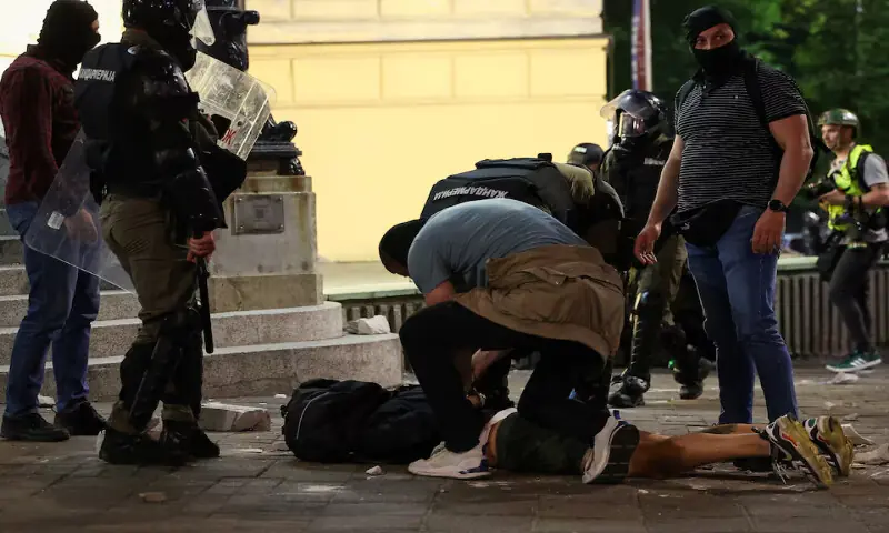 A demonstrator is handcuffed in Belgrade, Serbia. -- Reuters A demonstrator is handcuffed in Belgrade, Serbia. -- Reuters