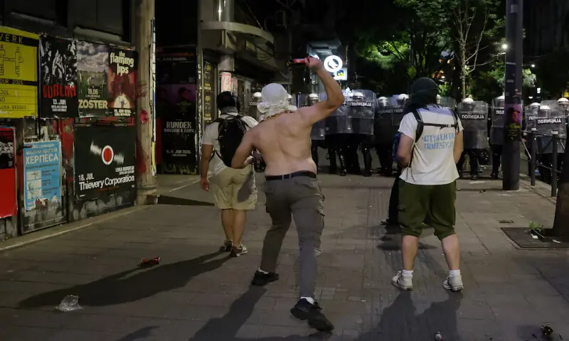 A demonstrator throws a bottle towards riot police during a student-led protest demanding snap parliamentary elections in Belgrade, Serbia. -- Reuters A demonstrator throws a bottle towards riot police during a student-led protest demanding snap parliamentary elections in Belgrade, Serbia. -- Reuters