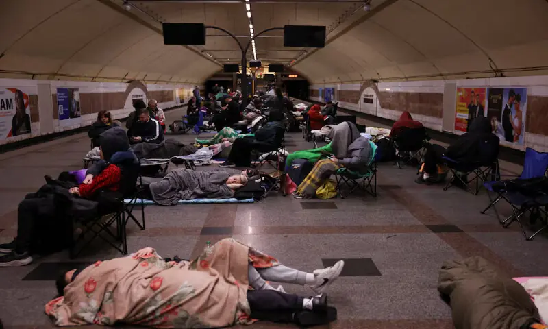 People take shelter inside a metro station during a Russian missile and drone strike in Kyiv, Ukraine. -- Reuters