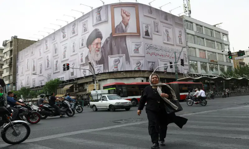 A woman walks near a billboard with an image of the late Iranian Supreme Leader Ayatollah Ali Khamenei, in Tehran, Iran. -- Reuters A woman walks near a billboard with an image of the late Iranian Supreme Leader Ayatollah Ali Khamenei, in Tehran, Iran. -- Reuters