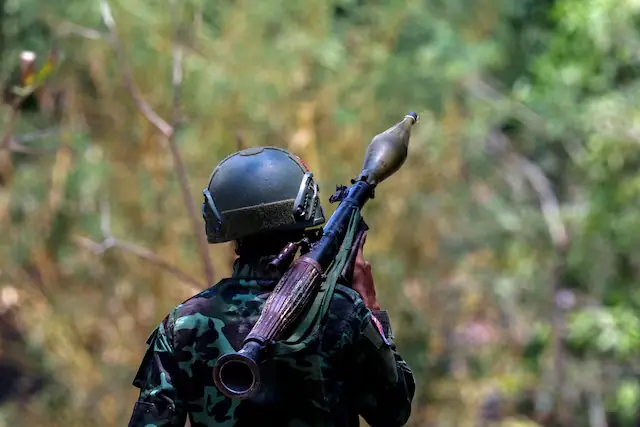 A soldier from the Karen National Liberation Army (KNLA) carries an RPG launcher at a Myanmar military base at Thingyan Nyi Naung village on the outskirts of Myawaddy. -- Reuters