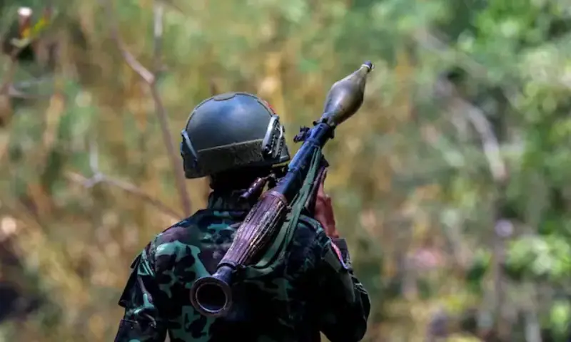 A soldier from the Karen National Liberation Army carries an RPG launcher at a Myanmar military base at Thingyan Nyi Naung village on the outskirts of Myawaddy. -- Reuters